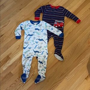 Set of 2 - Carter's footed pajamas, dinosaurs and fire trucks.